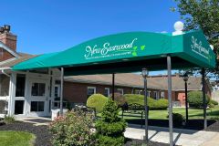 A vibrant, branded canopy wrap installed at a New Eastwood Retirement home