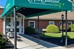A vibrant, branded canopy wrap installed at a New Eastwood Retirement home