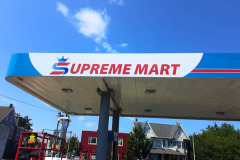 A gas station canopy wrapped with vibrant, branded vinyl, featuring bold colors and clean lines that enhance its visibility and appeal.