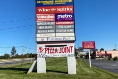 Monument signs in Allentown with multiple businesses in a plaza